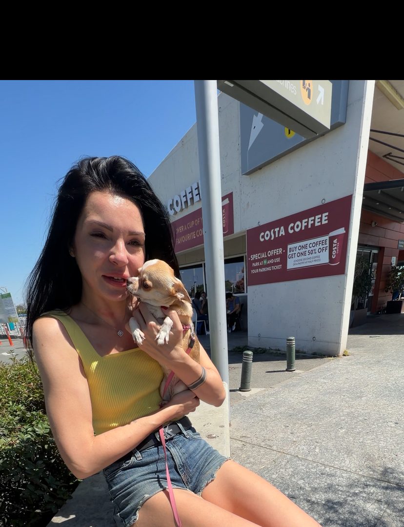 Happy client reunited with her dog